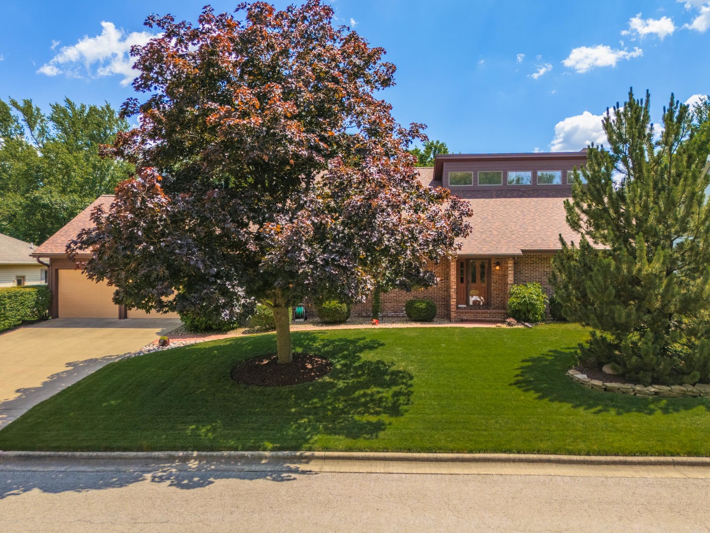 905 Rhymer Drive Normal, IL 61761 - Photo 1 of 47 a front view of a house with a yard and garage