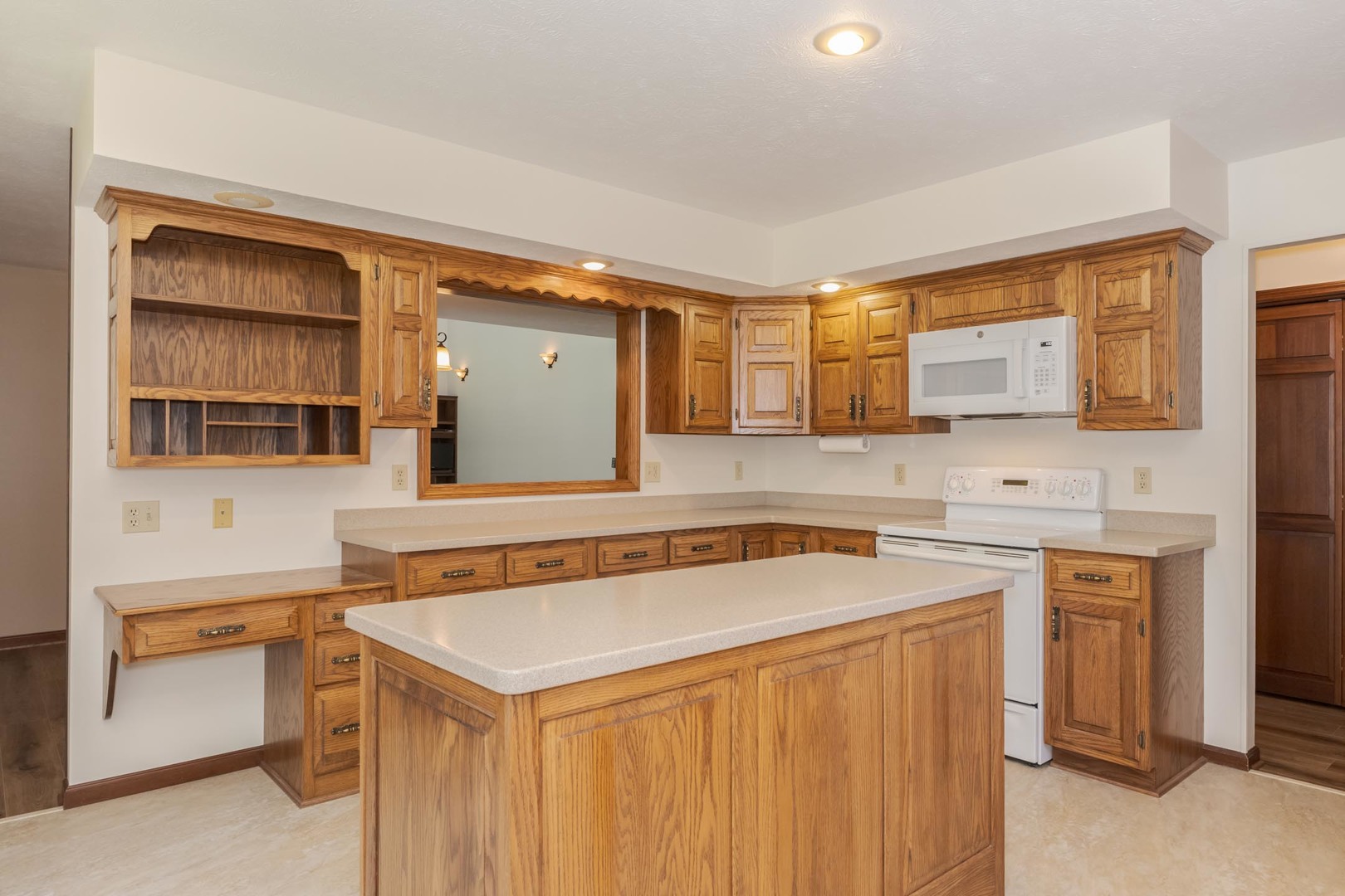 905 Rhymer Drive Normal, IL 61761 - Photo 14 of 47 a utility room with stainless steel appliances cabinets and a table and chairs