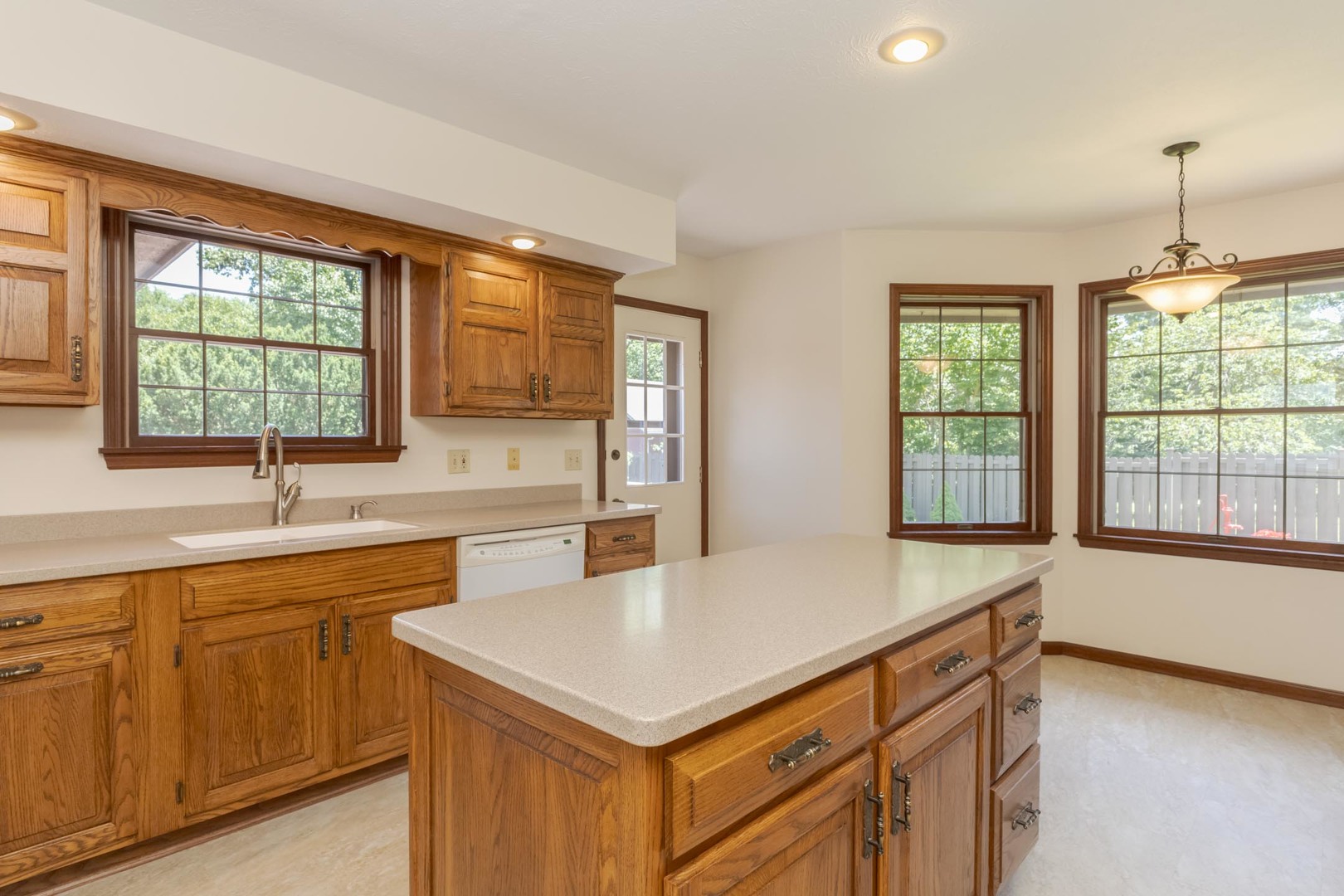 905 Rhymer Drive Normal, IL 61761 - Photo 16 of 47 a kitchen with a stove a sink and a refrigerator