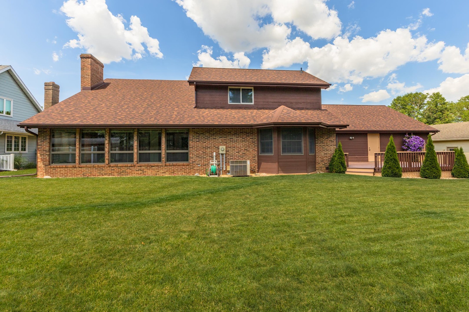 905 Rhymer Drive Normal, IL 61761 - Photo 2 of 47 a front view of a house with a garden and porch
