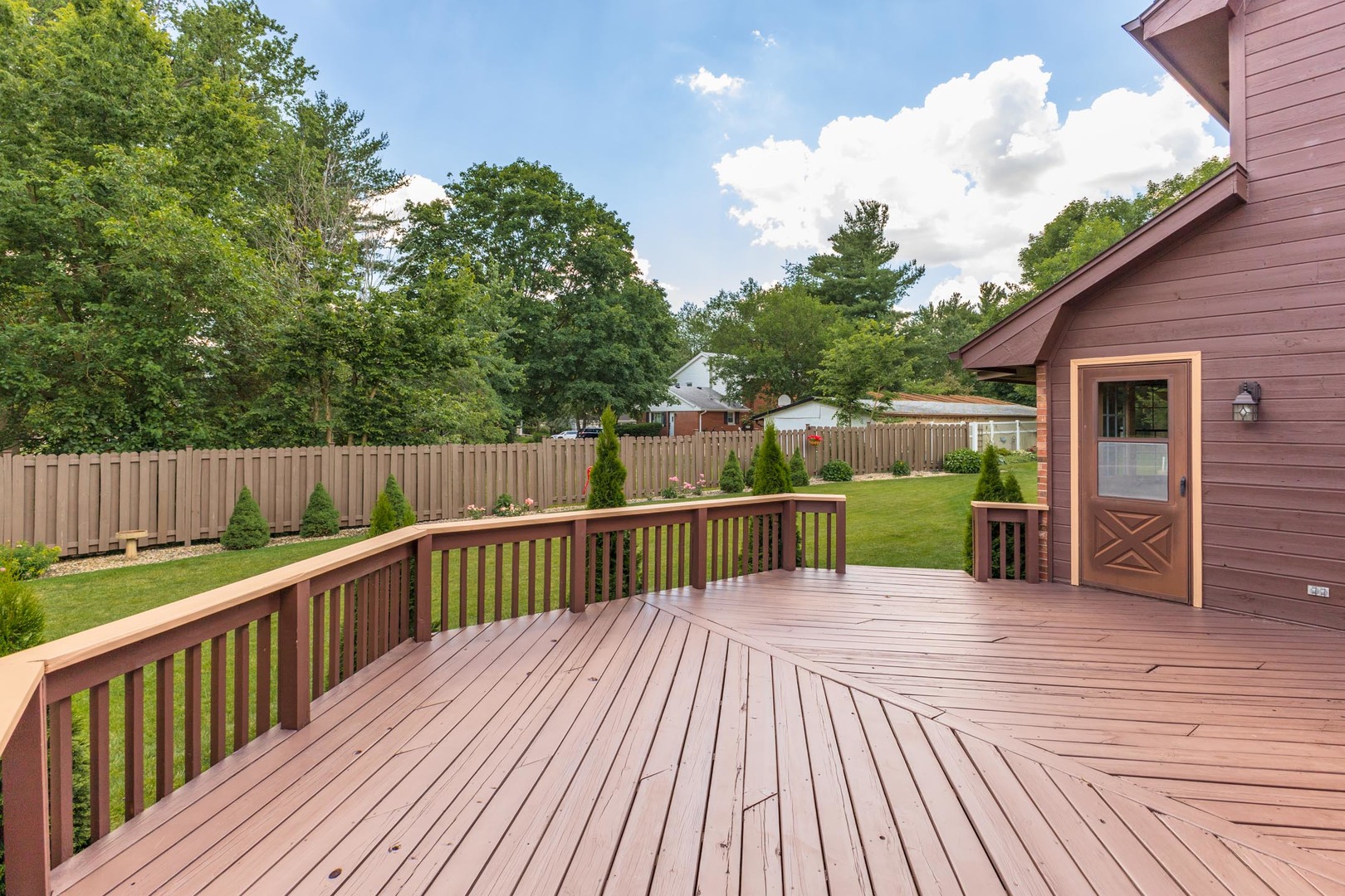 905 Rhymer Drive Normal, IL 61761 - Photo 40 of 47 a view of a balcony with wooden floor and fence