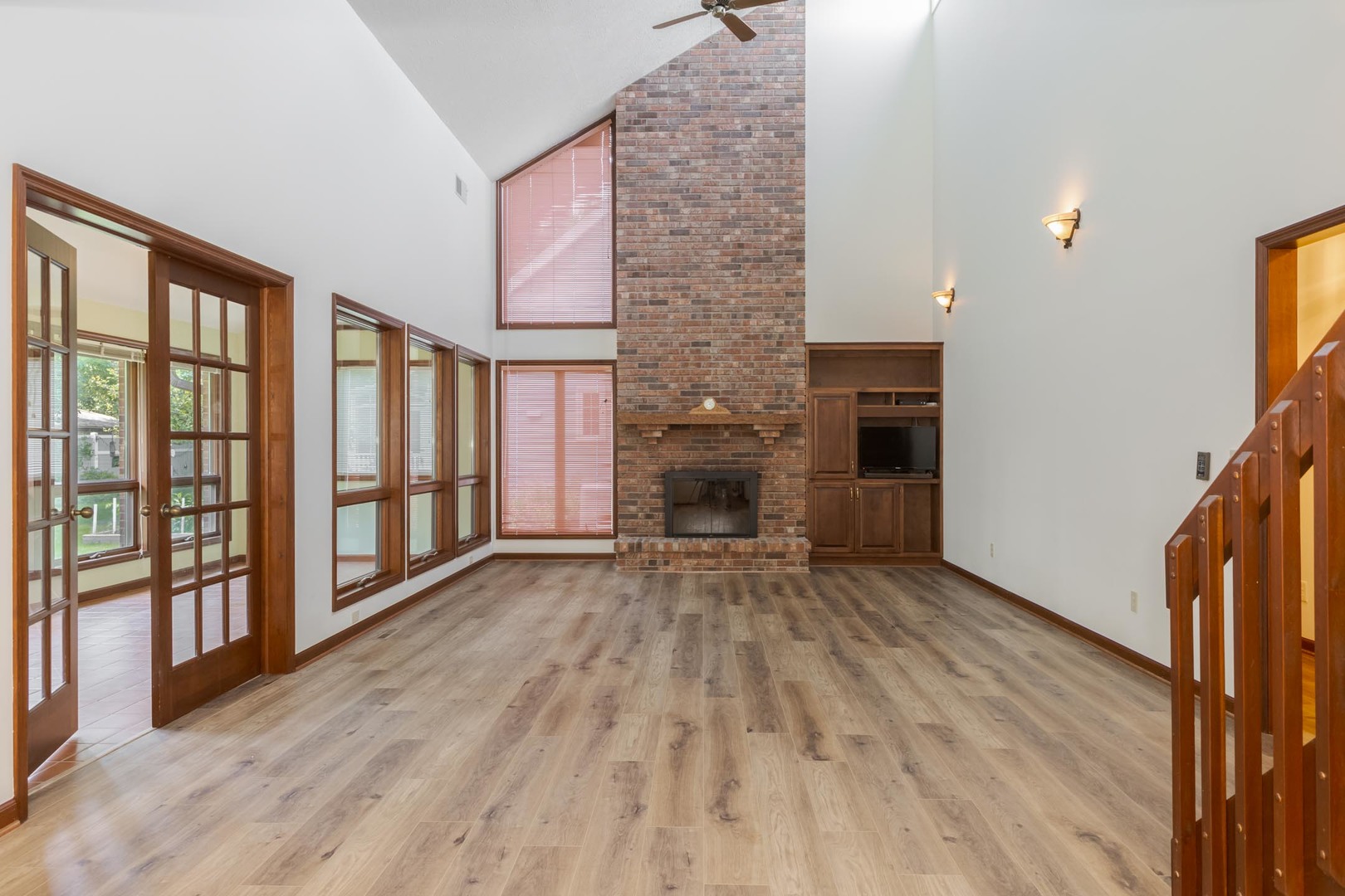 905 Rhymer Drive Normal, IL 61761 - Photo 4 of 47 a view of empty room with wooden floor and fireplace