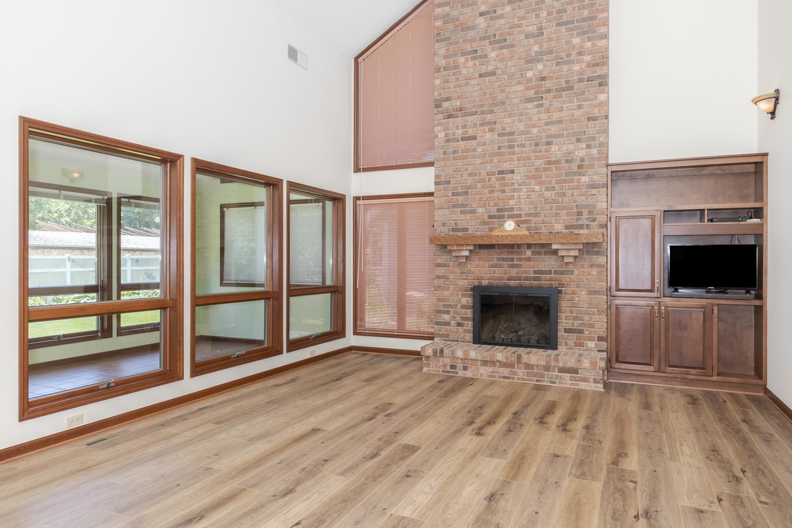 905 Rhymer Drive Normal, IL 61761 - Photo 5 of 47 a view of a livingroom with an empty space and a fireplace