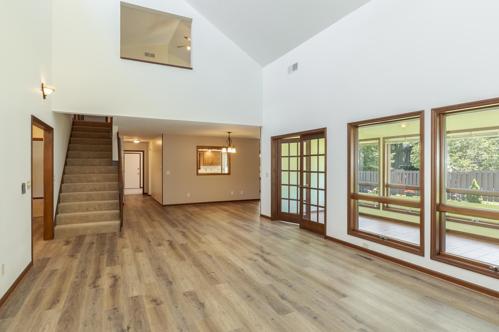 905 Rhymer Drive Normal, IL 61761 - Photo 7 of 47 a view of a livingroom with wooden floor and stairs