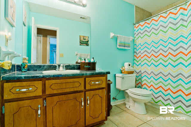 402 Oakleigh Circle Foley, AL 36535 - Photo 15 of 17 Guest bathroom is a cheerful color.