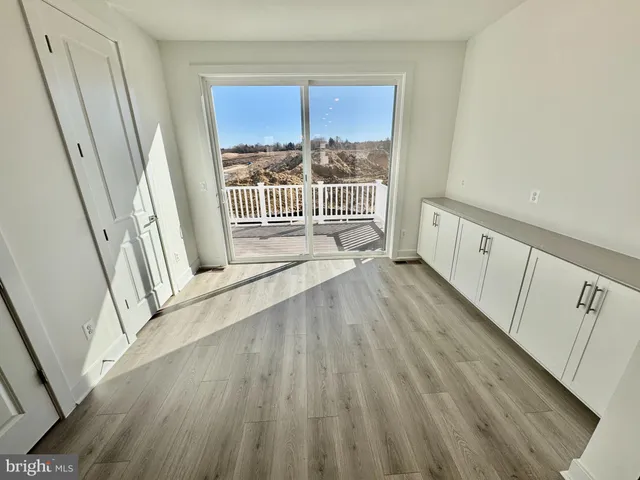 a view of front door with wooden floor