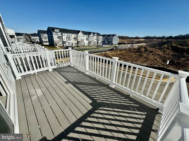 a view of balcony with wooden floor