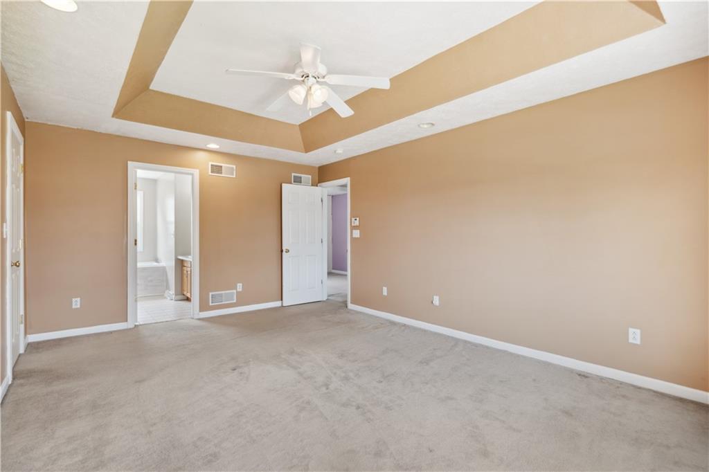 122 Walnut Circle Elizabeth, PA 15037 - Photo 33 of 50 en empty room with a ceiling fan and a window