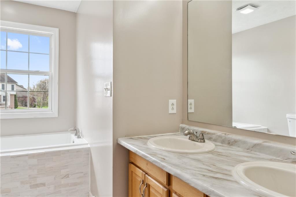 122 Walnut Circle Elizabeth, PA 15037 - Photo 35 of 50 a bathroom with a granite countertop sink and a mirror