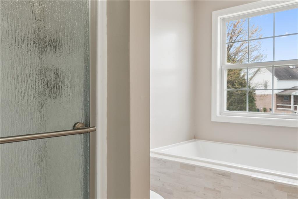 122 Walnut Circle Elizabeth, PA 15037 - Photo 36 of 50 a bathroom with a bathtub and a window