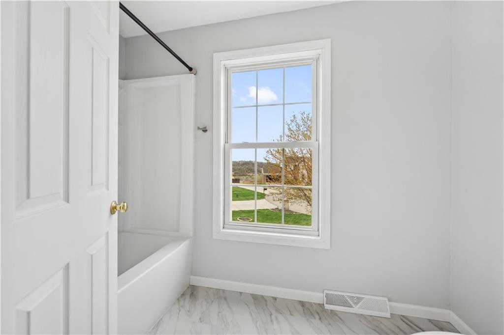 122 Walnut Circle Elizabeth, PA 15037 - Photo 47 of 50 a bathroom with a bathtub and window