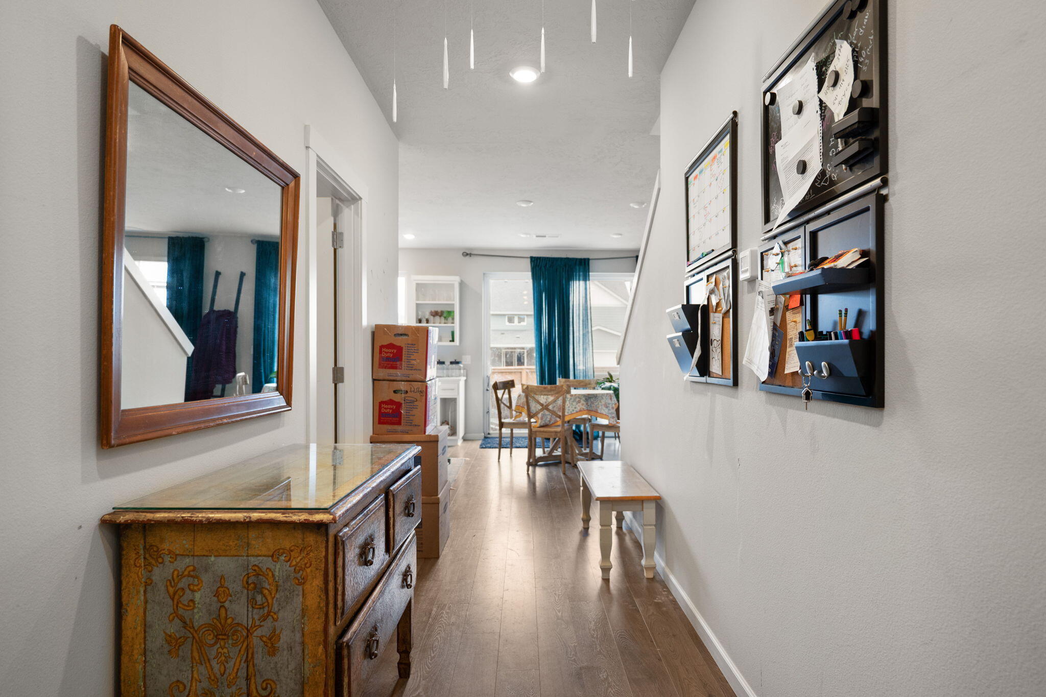 4039 Southwest Quartz Place Redmond, OR 97756 - Photo 5 of 44 a view of a hallway with wooden floor and furniture
