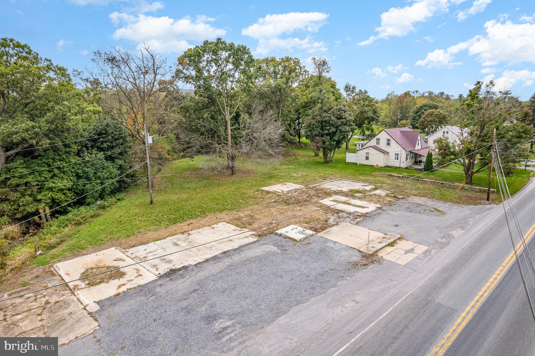 401-403 West Main Street Walnut Bottom, PA 17266 - Photo 13 of 13 a view of a yard with flower plants