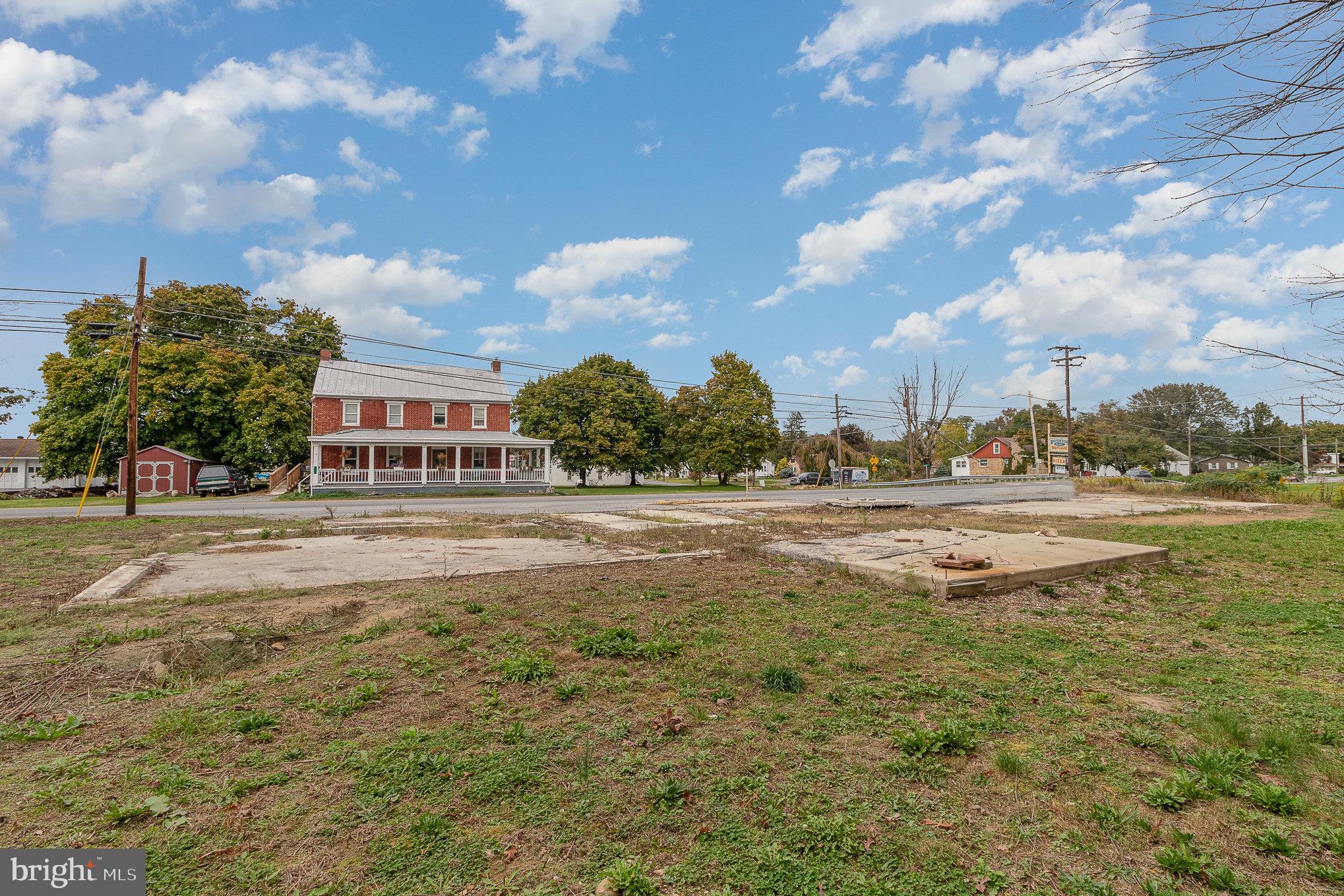 401-403 West Main Street Walnut Bottom, PA 17266 - Photo 3 of 13 a swimming pool with outdoor seating and yard