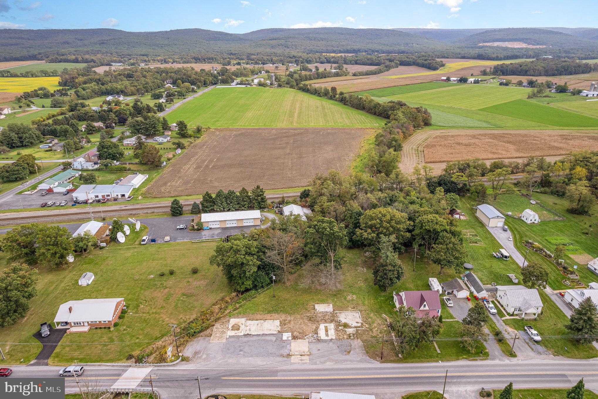 401-403 West Main Street Walnut Bottom, PA 17266 - Photo 6 of 13 an aerial view of residential houses with outdoor space and river