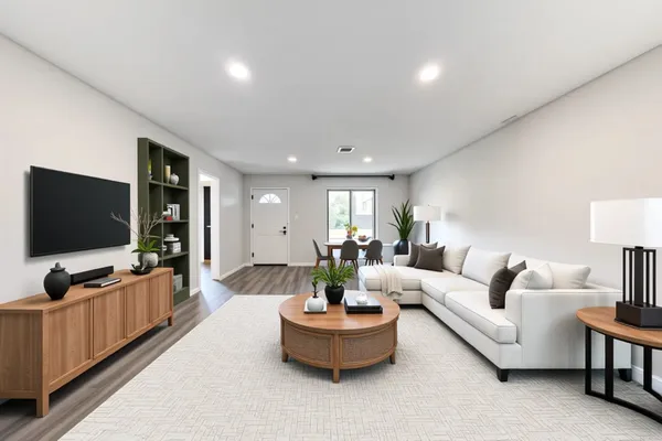 a living room with furniture and a flat screen tv