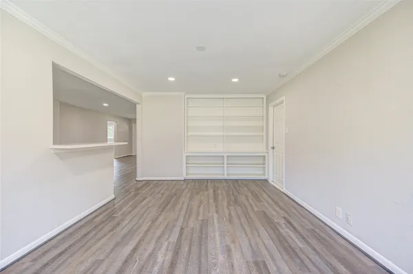a view of a room with wooden floor and closet