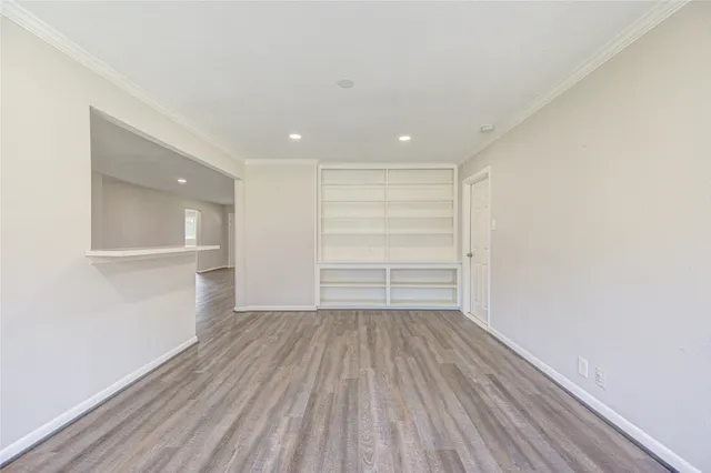 a view of a room with wooden floor and closet