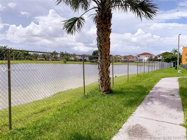 a view of a garden and lake