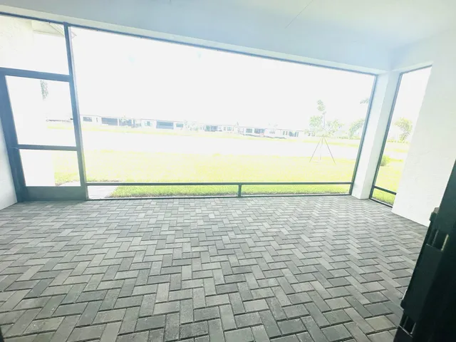 a view of a swimming pool and an outdoor seating