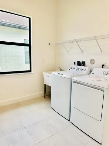 a utility room with dryer and washer