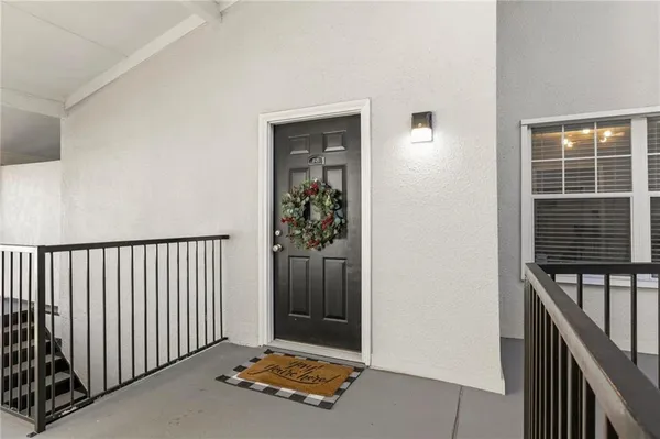 a view of an entryway with a door