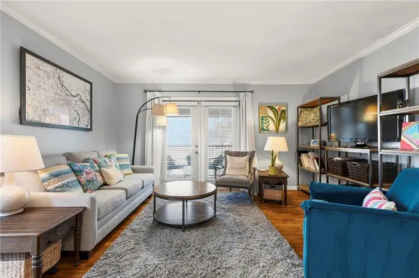 a living room with furniture and a flat screen tv