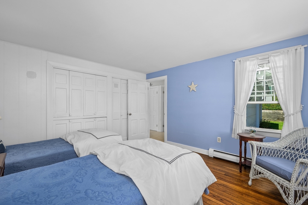 216 Forest Beach Road Chatham, MA 02659 - Photo 13 of 42 a bedroom with a bed and a window