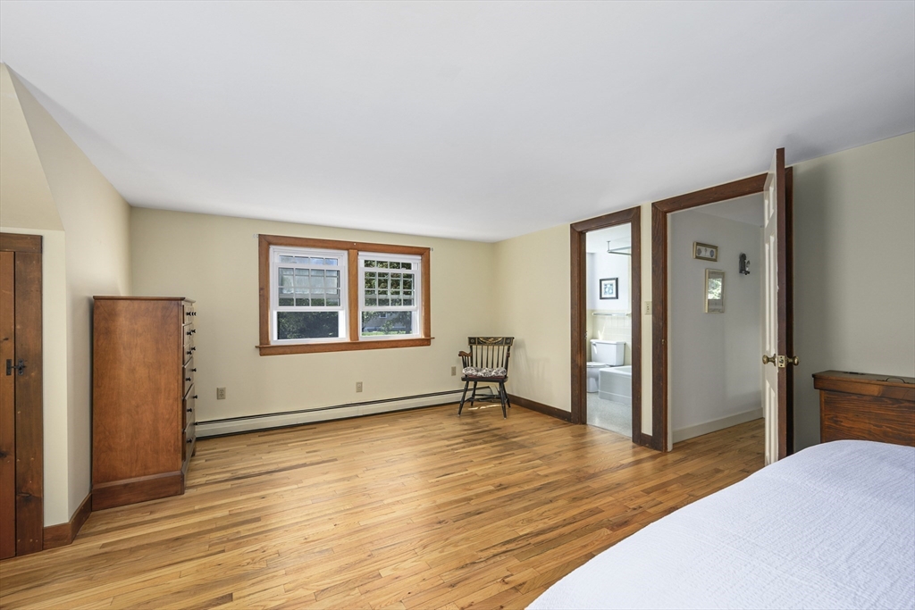 216 Forest Beach Road Chatham, MA 02659 - Photo 17 of 42 a view of an empty room with wooden floor and a window