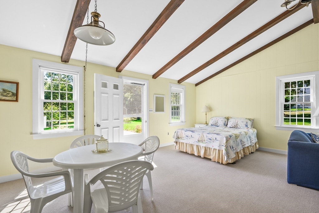 216 Forest Beach Road Chatham, MA 02659 - Photo 24 of 42 a bedroom with furniture and windows