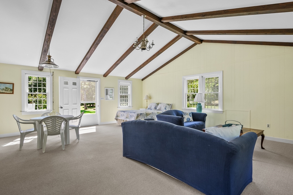 216 Forest Beach Road Chatham, MA 02659 - Photo 25 of 42 a living room with furniture and a window