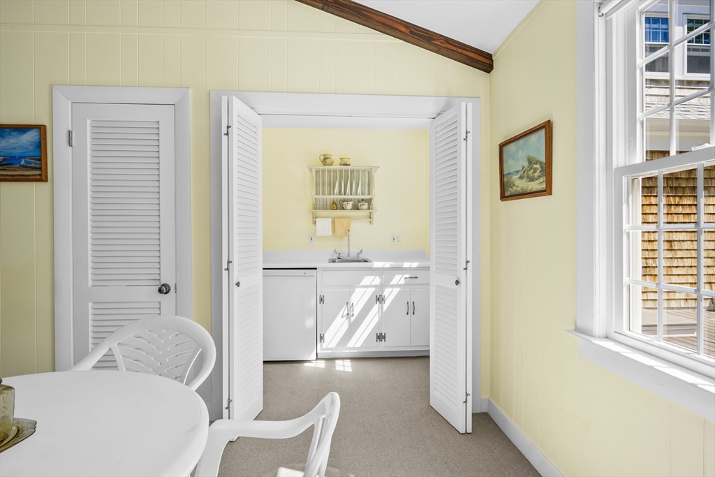 216 Forest Beach Road Chatham, MA 02659 - Photo 27 of 42 a living room with furniture and a table