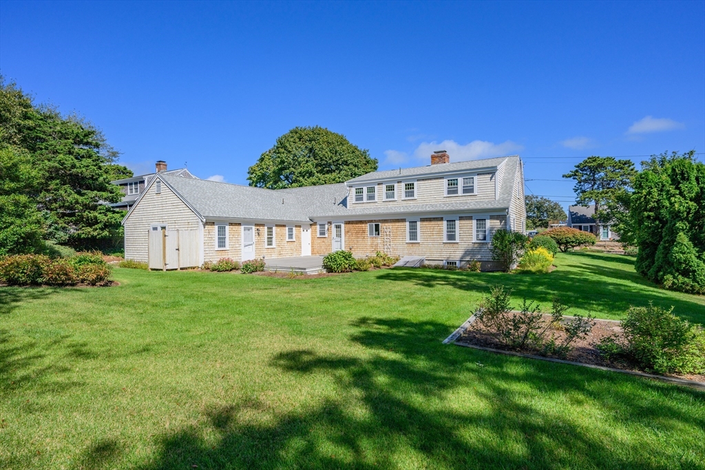 216 Forest Beach Road Chatham, MA 02659 - Photo 31 of 42 a view of a house with a big yard