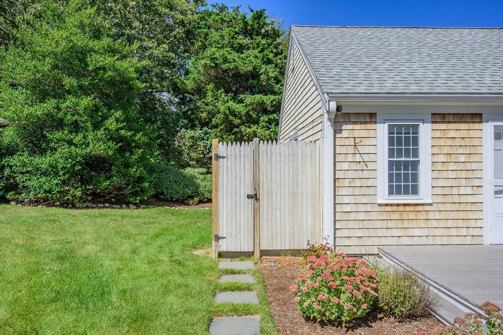 216 Forest Beach Road Chatham, MA 02659 - Photo 34 of 42 a front view of a house with garden