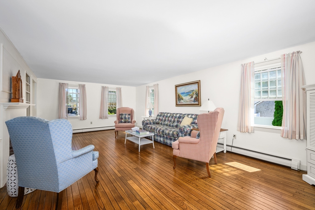 216 Forest Beach Road Chatham, MA 02659 - Photo 4 of 42 a living room with furniture and a wooden floor