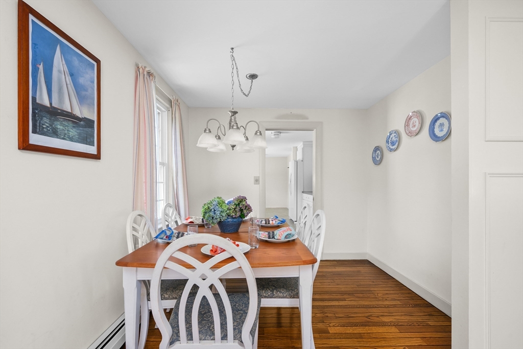 216 Forest Beach Road Chatham, MA 02659 - Photo 9 of 42 a view of a dining room with furniture and wooden floor