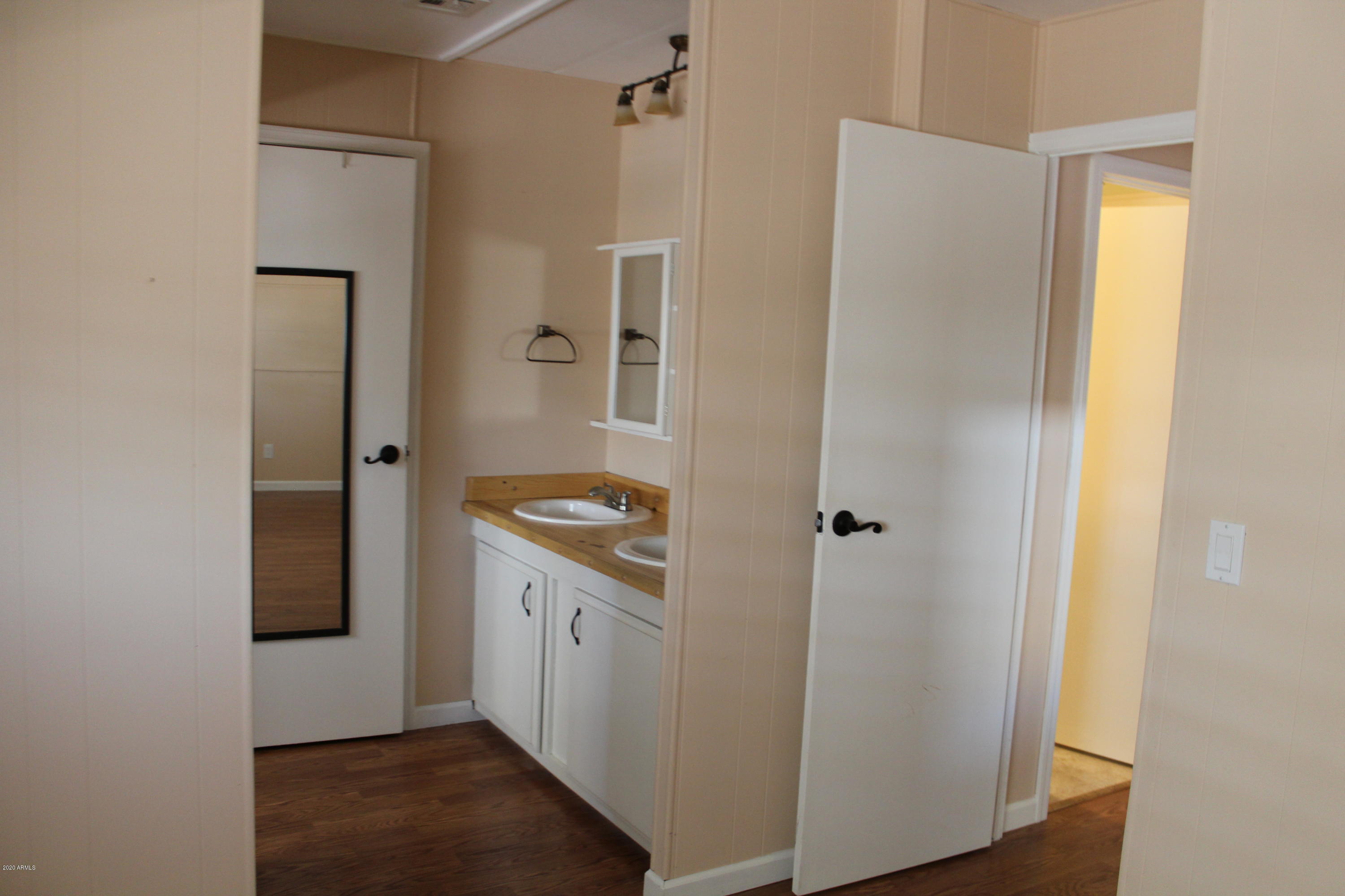 301 South Signal Butte Road, Unit 626 Apache Junction, AZ 85120 - Photo 12 of 28 a view of bathroom with a sink and mirror
