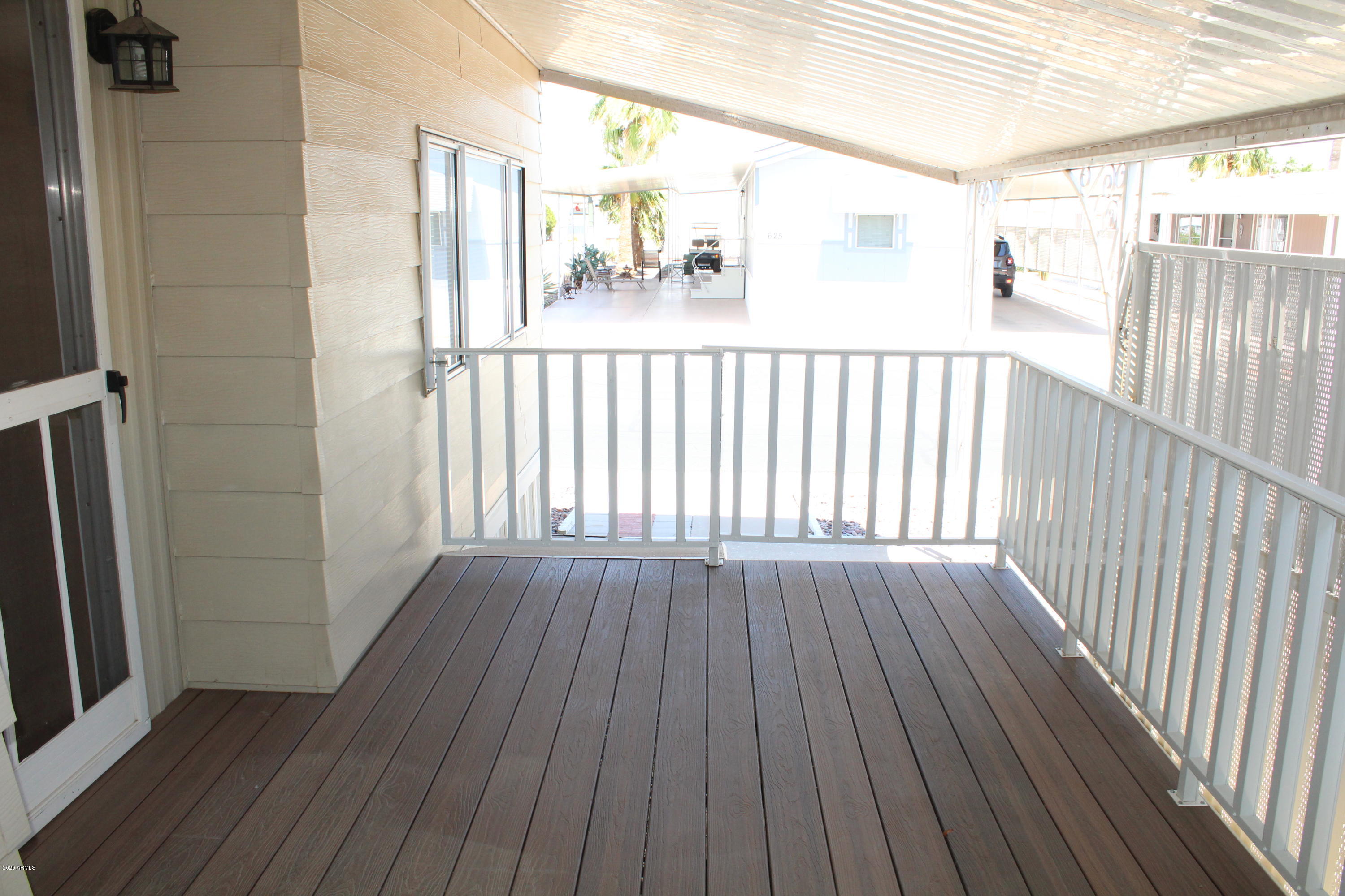 301 South Signal Butte Road, Unit 626 Apache Junction, AZ 85120 - Photo 20 of 28 a view of a balcony with wooden floor