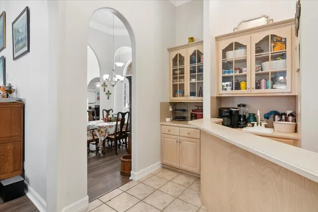 a kitchen with cabinets and window