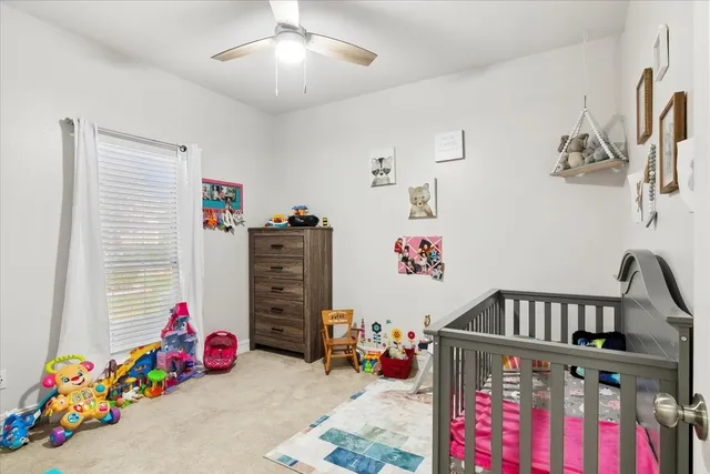 a bedroom with furniture and baby