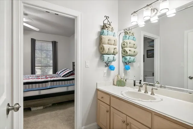 a en suite bathroom with a sink and a mirror
