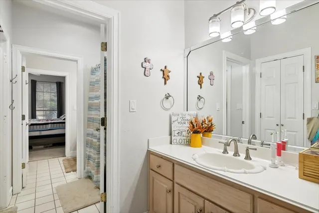 a bathroom with a sink a vanity and a mirror