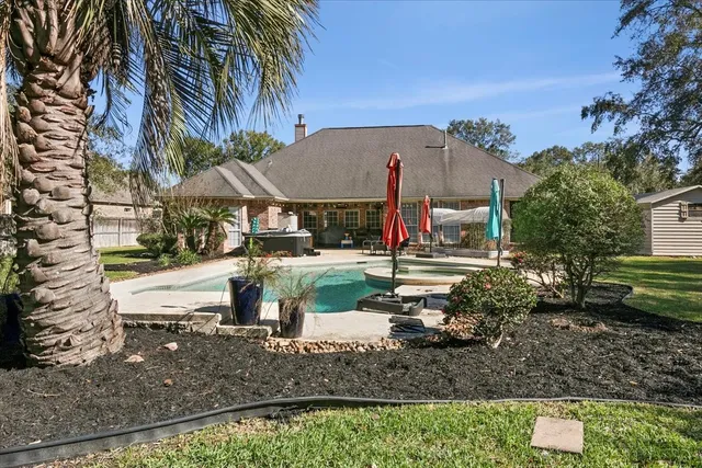 a swimming pool view with a seating space