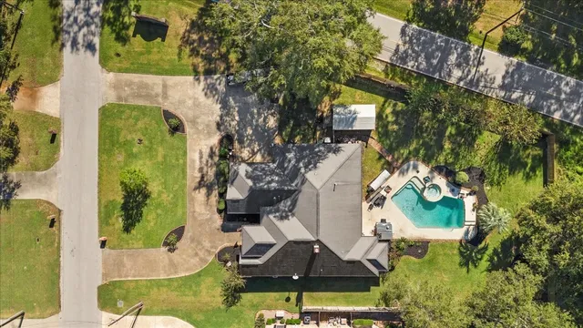 an aerial view of a house with swimming pool