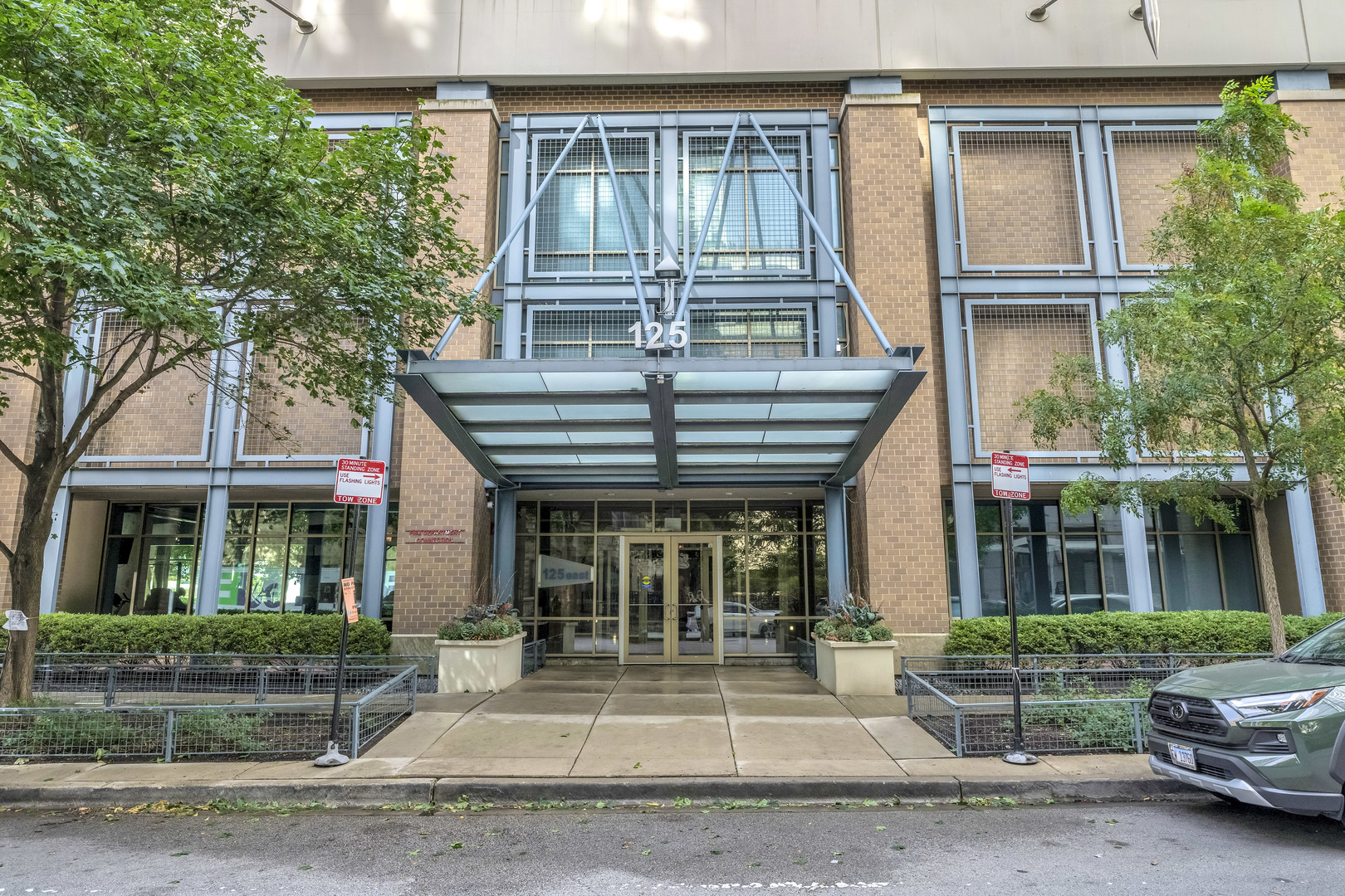 125 East 13th Street, Unit 1213 Chicago, IL 60605 - Photo 1 of 21 a front view of a house with a porch