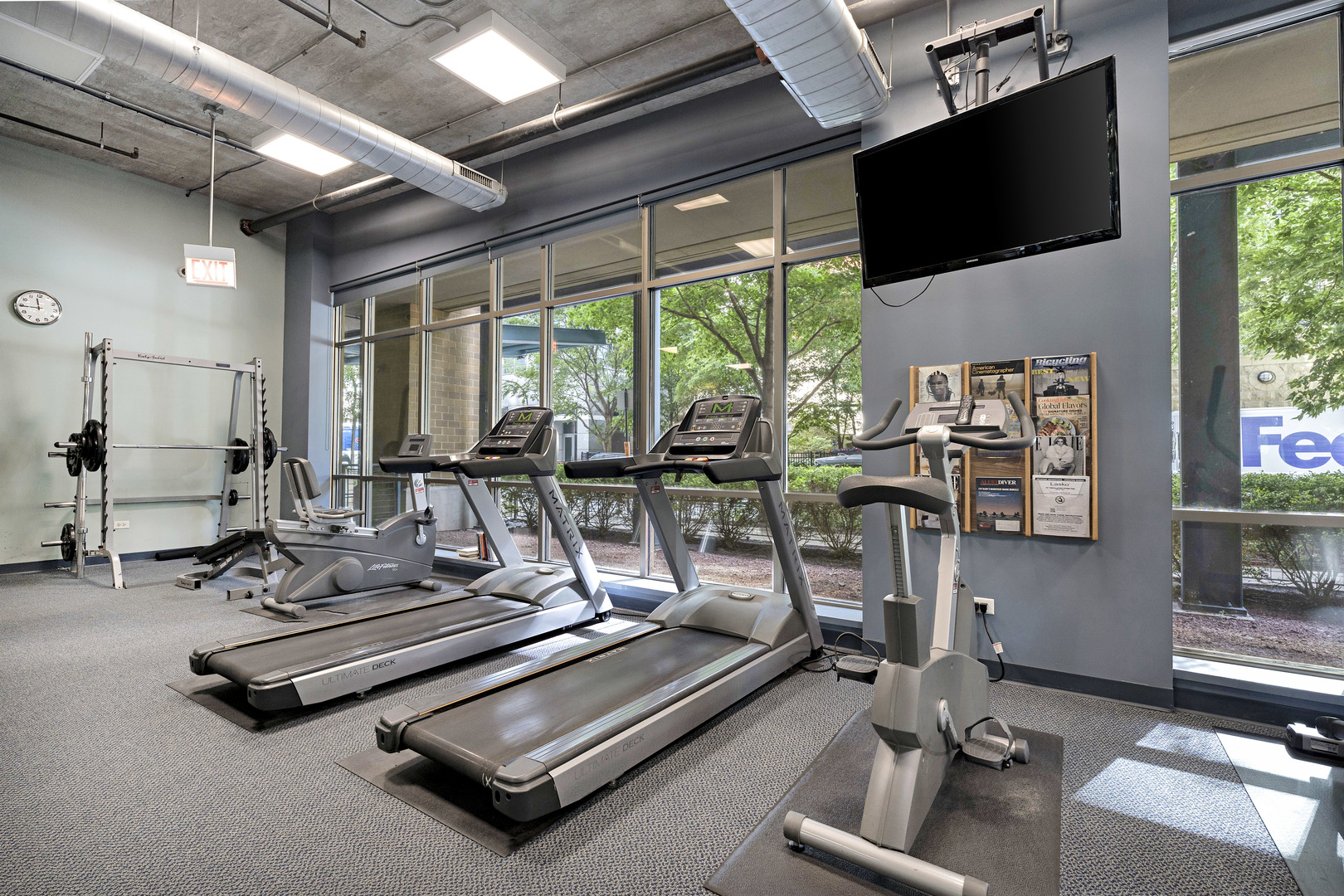 125 East 13th Street, Unit 1213 Chicago, IL 60605 - Photo 21 of 21 a room with gym equipment and a large window