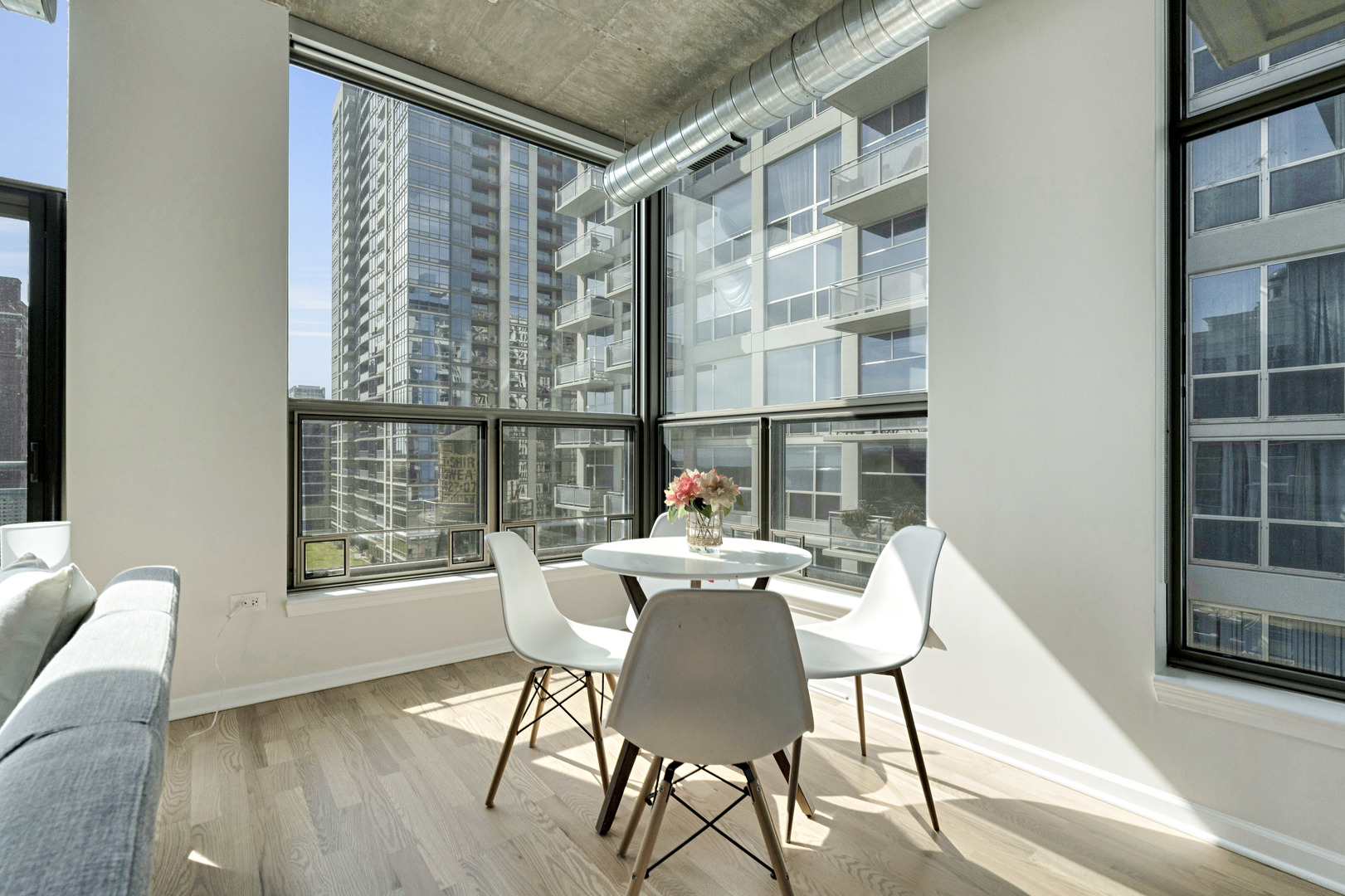 125 East 13th Street, Unit 1213 Chicago, IL 60605 - Photo 5 of 21 a dining room with furniture and window