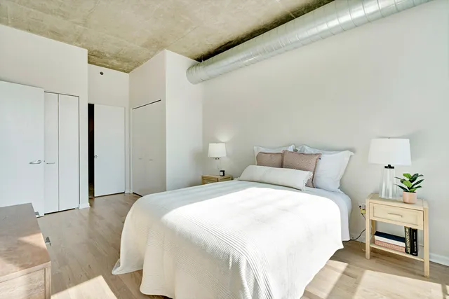 a bedroom with a bed and a couch