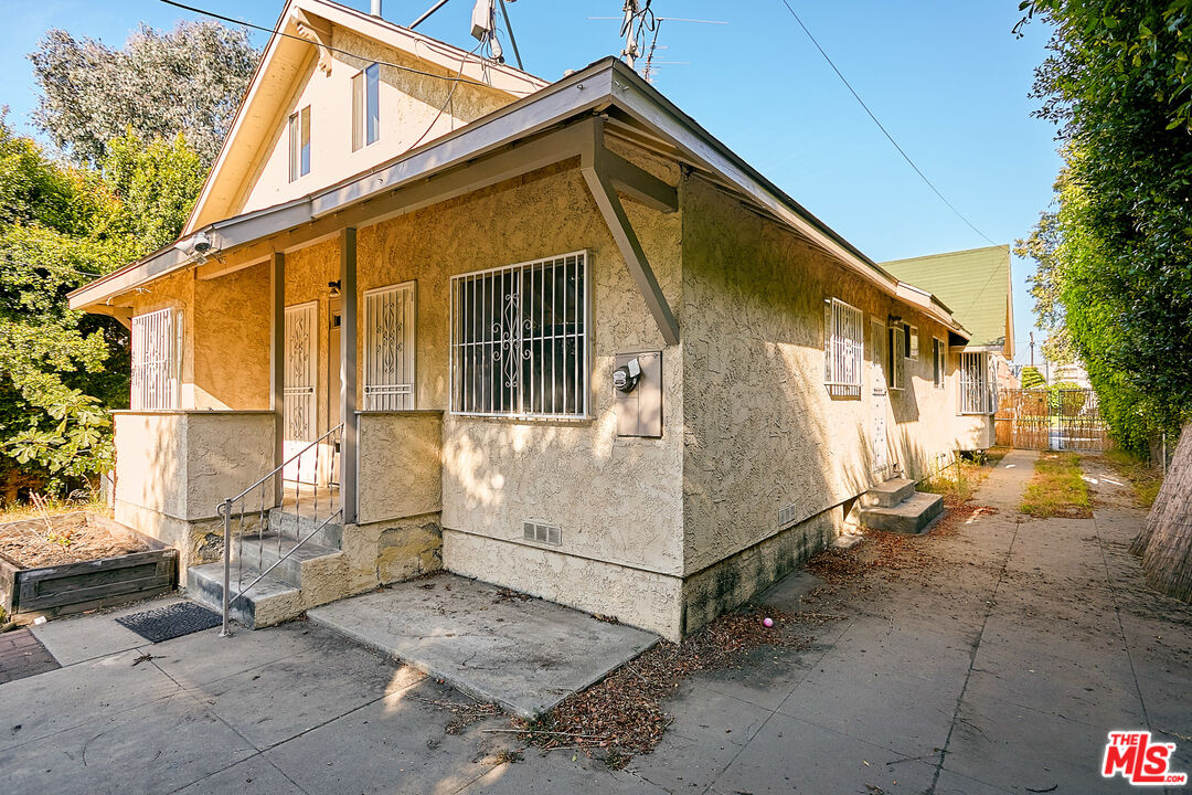 1253 Keniston Avenue Los Angeles, CA 90019 - Photo 35 of 35 a view of a house with a outdoor space