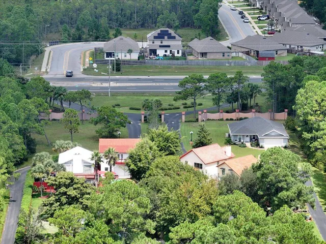 an aerial view of a house with yard swimming pool and outdoor seating